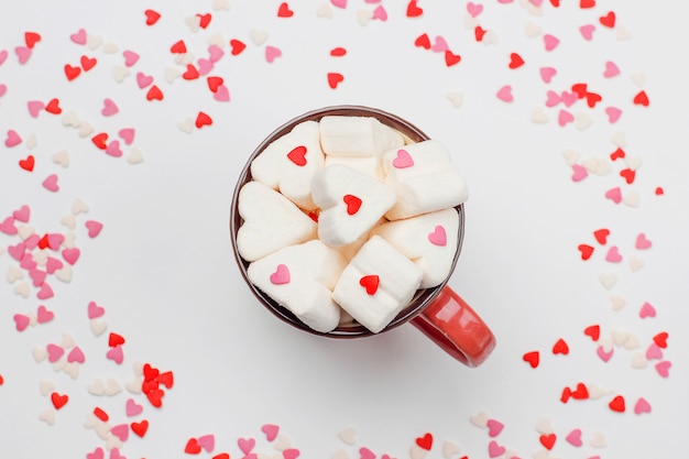 Sweet hearts and a cup of coffe with marshmallows