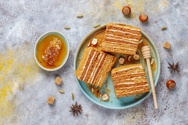 Sweet homemade layered honey cake with spices and nuts.