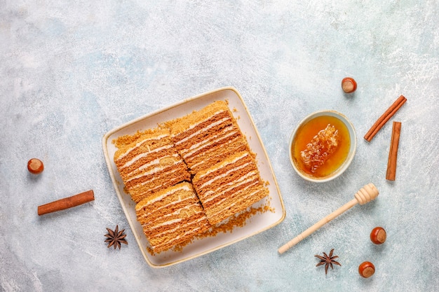 Free photo sweet homemade layered honey cake with spices and nuts.