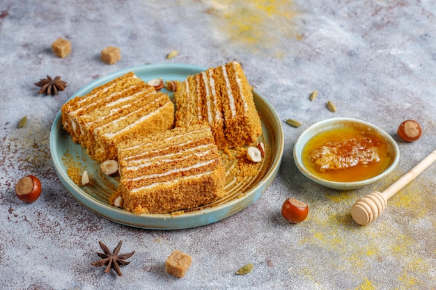 Sweet homemade layered honey cake with spices and nuts.