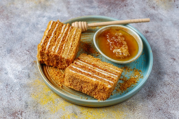 Free photo sweet homemade layered honey cake with spices and nuts.