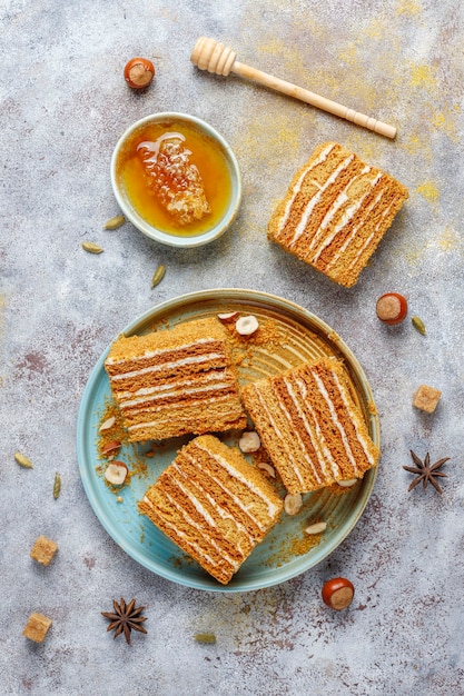 Free photo sweet homemade layered honey cake with spices and nuts.