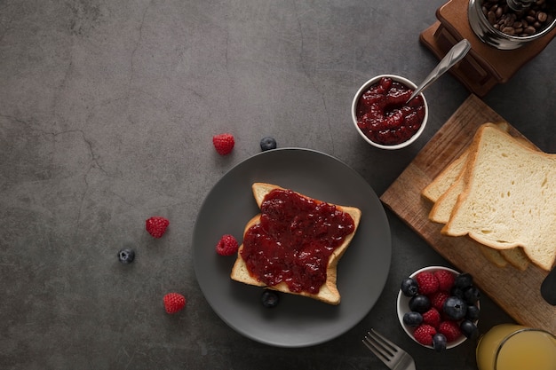 Free photo sweet homemade natural jam on slice of  bread