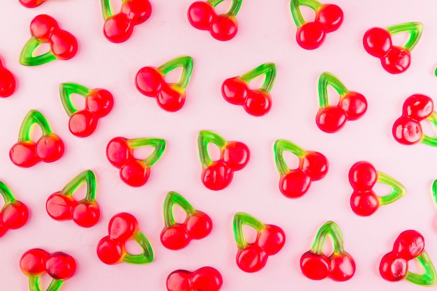 Free photo sweet jelly cherry candies on pink surface