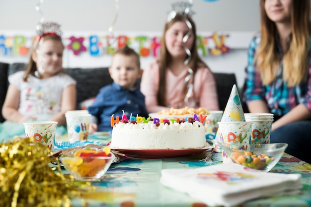 Sweet kids table with birthday cake 