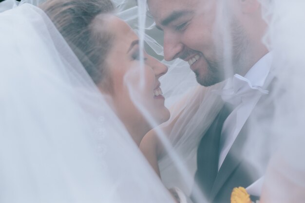 A sweet kiss. Bride and groom at the wedding