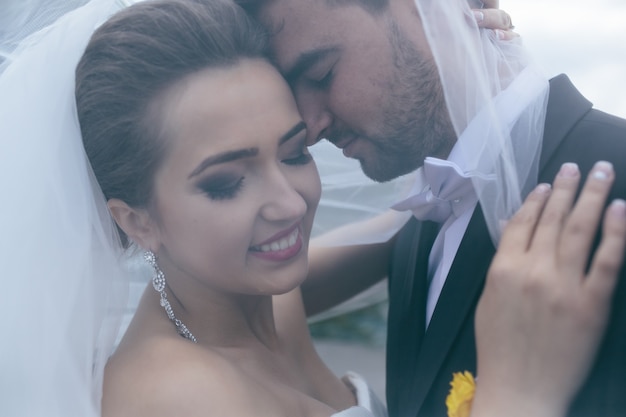 A sweet kiss. Bride and groom at the wedding