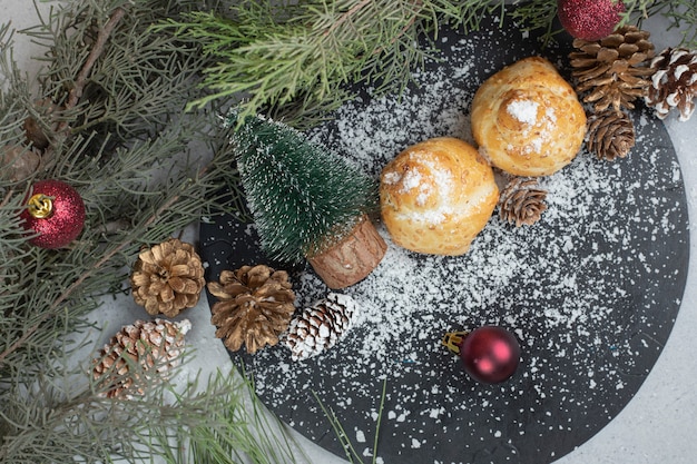 Sweet pastry with pinecones and Christmas tree