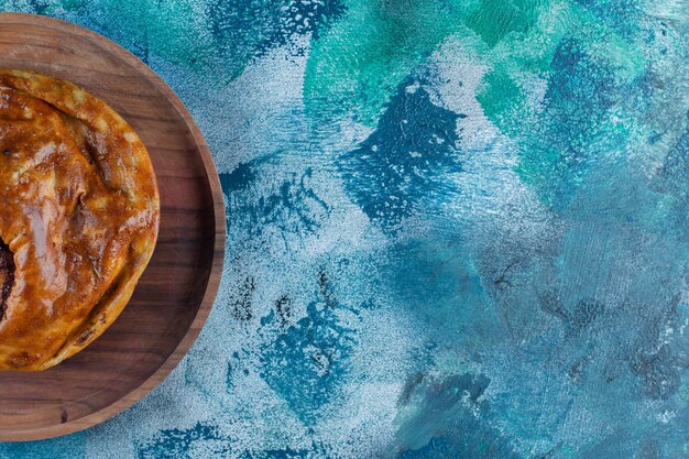 Sweet pie on a plate , on the marble table. 