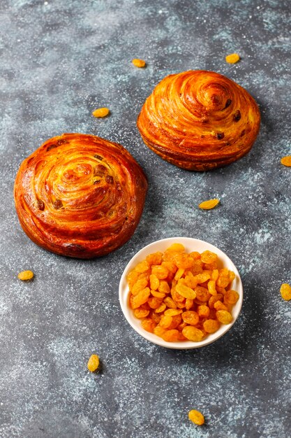 Sweet round french buns with raisins.