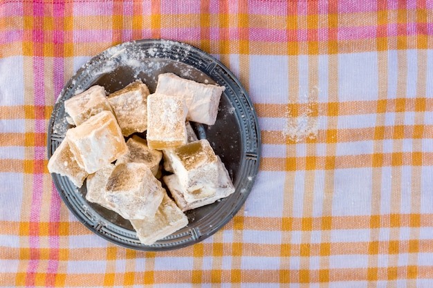 Free Photo sweet turkish delight on checkered cloth