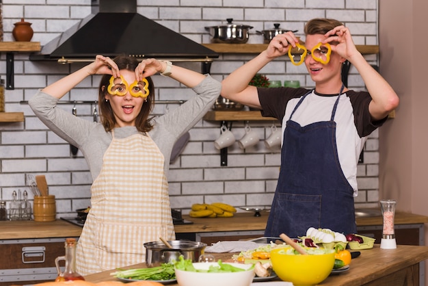 Free Photo sweethearts making funny faces in kitchen