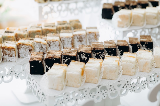 Sweets are served on layered stands