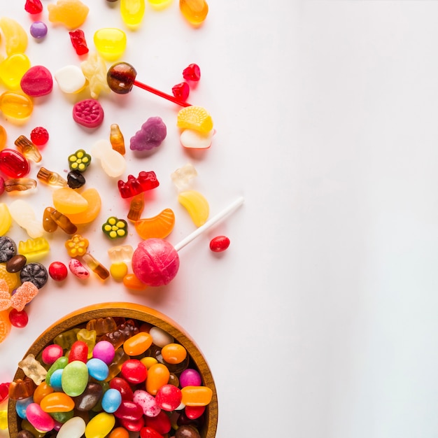 Sweets on left side of white background