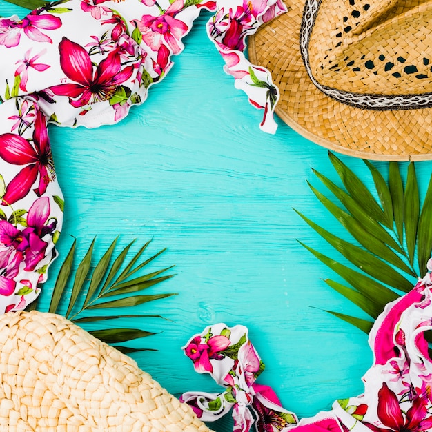 Swimsuit near plant leaves and hat