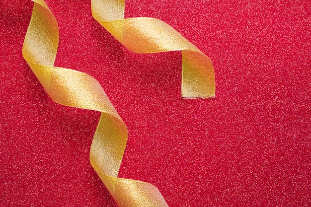 Free Photo swirling ribbons on red background