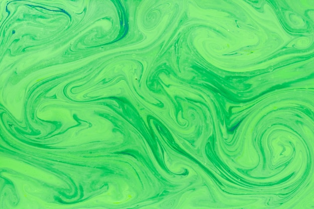 Free photo swirls in liquid with green paint