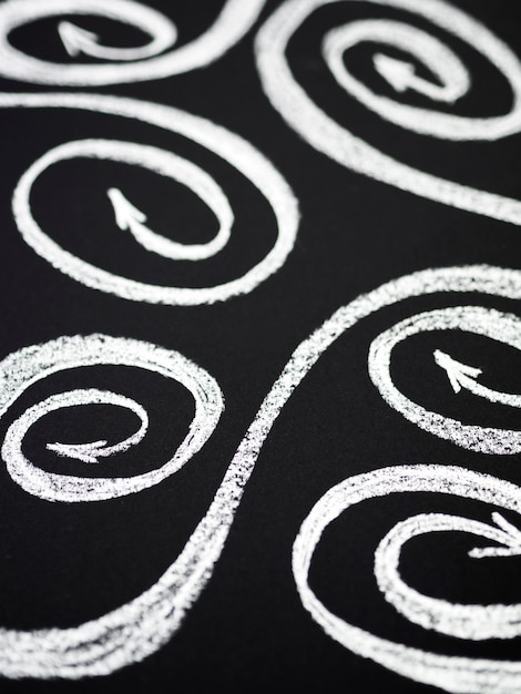 Free Photo swirly arrows drawn with chalk