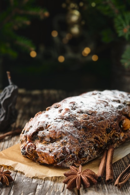 Swiss Christmas Pear Bread - BÃ¼ndner Birnbrot or Paun cun paira, a local dish filled with dried pears, fruits and nuts. Selective focus. Pie close-up on a wooden table. New Year's tea party