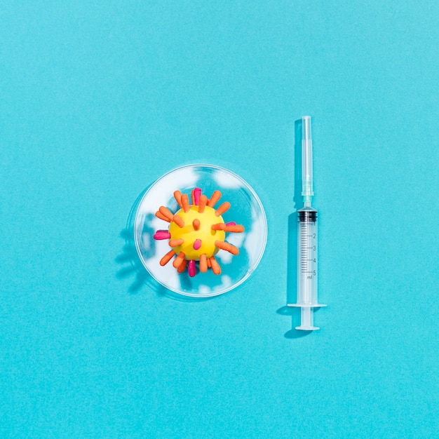 Syringe beside virus bacteria