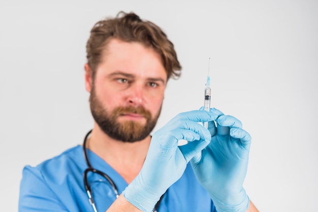 Free Photo syringe in hands with gloves of nurse man 