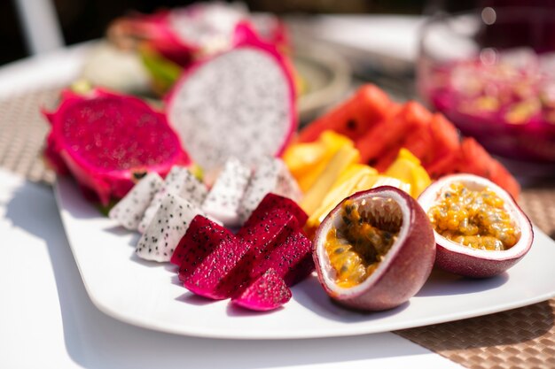 Free Photo table arrangement with dragon fruit snacks outdoors