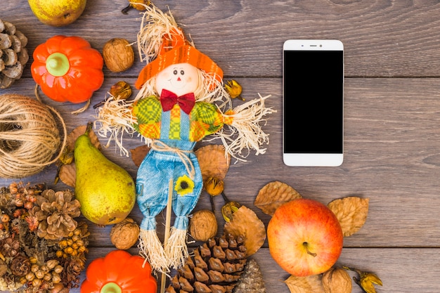 Free photo table covered with vegetables and smartphone