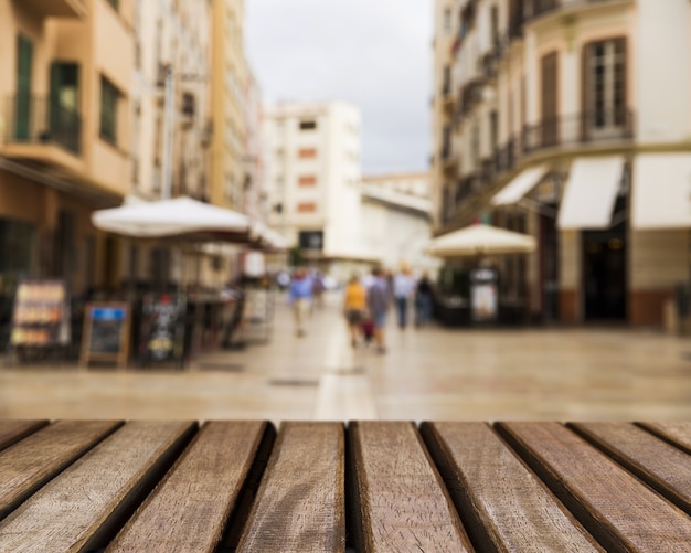 Free photo table texture looking out to city scene