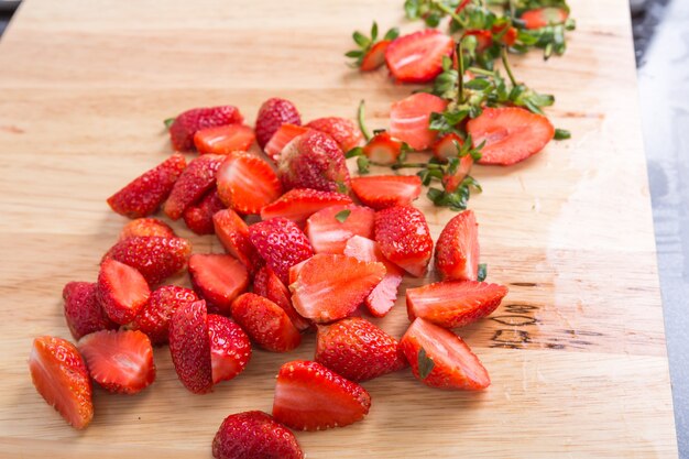 Table with cut strawberries