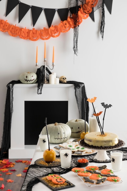 Table with halloween party treats and decorations