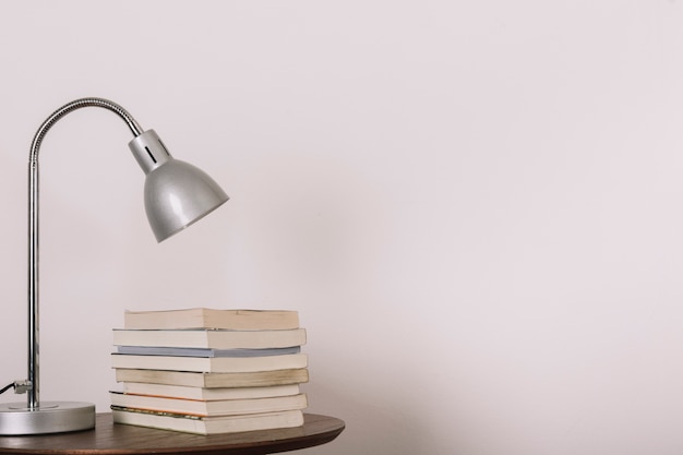 Table with lamp and books