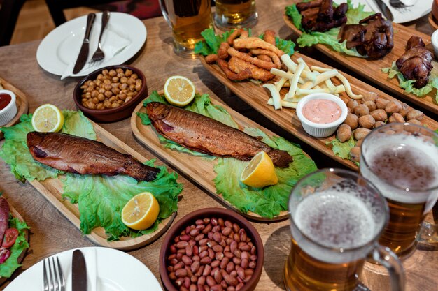 Table with lots of snacks and beer 1