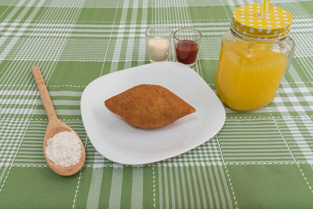 Table with several Brazilian snacks