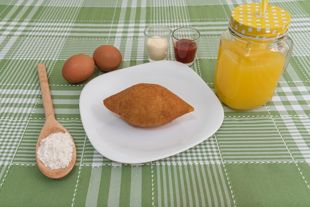 Table with several Brazilian snacks