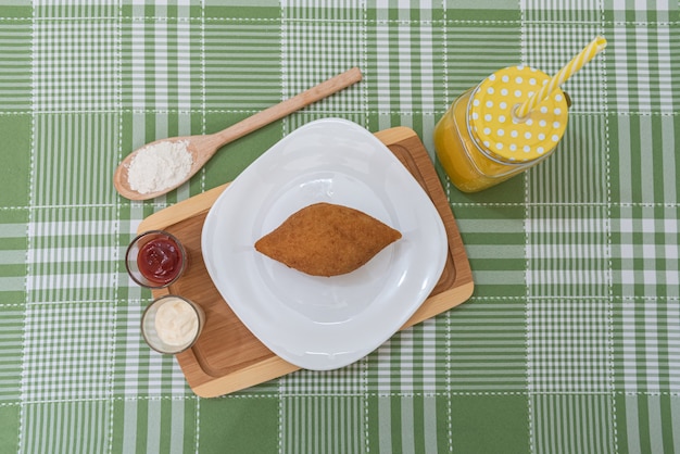 Table with several Brazilian snacks