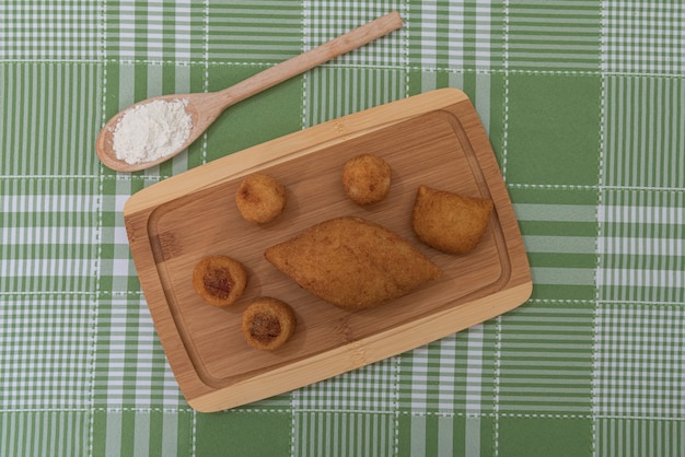 Table with several Brazilian snacks