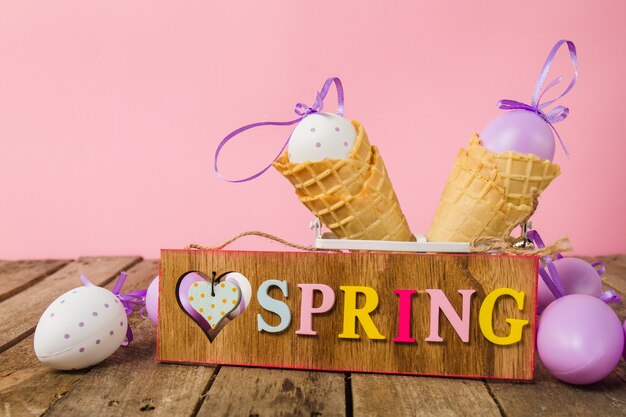 Table with spring sign and easter eggs