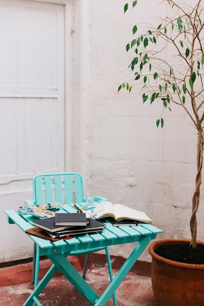 Table with watercolor and sketchbooks