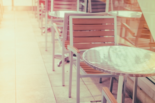 Free Photo tables and chairs in restaurant ( filtered image processed vinta