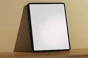 Free photo tablet minimal display on wooden surface