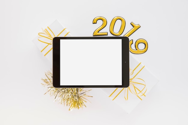 Free photo tablet near 2019 numbers and gift boxes