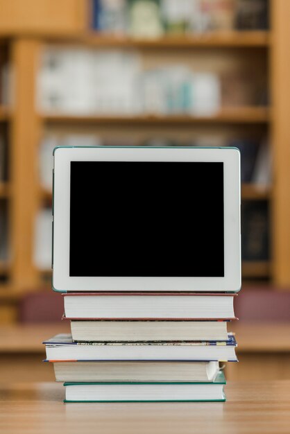 Tablet on stack of books