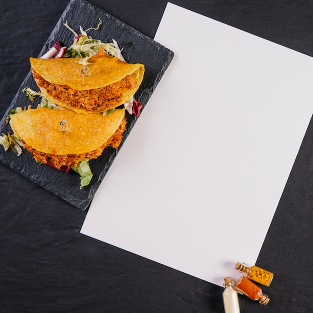 Tacos near paper sheet