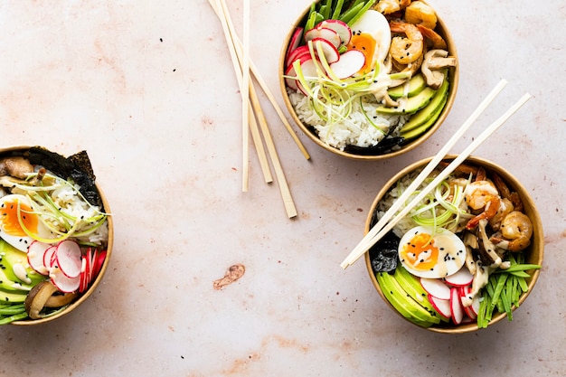 Free photo takeaway egg and prawn poke bowls