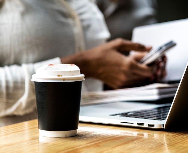 Takeway coffee cup in an office