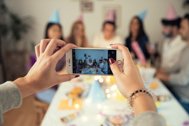 Taking photo of birthday party