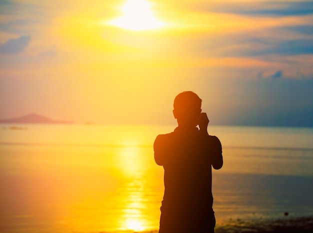 an taking photos of sunset