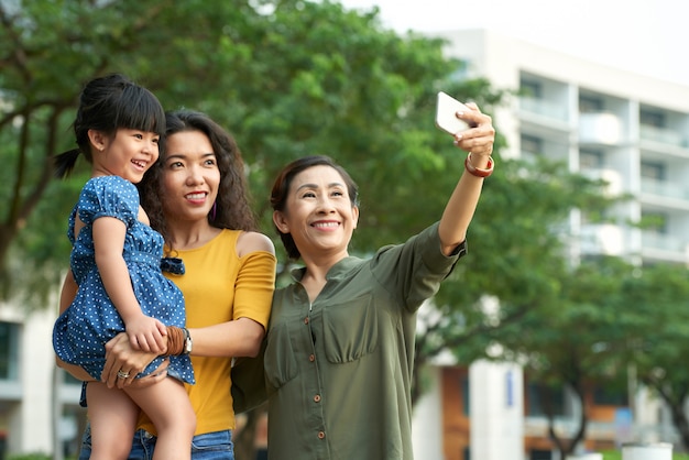 Free photo taking selfie with family