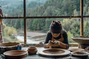 Free photo talented child doing pottery