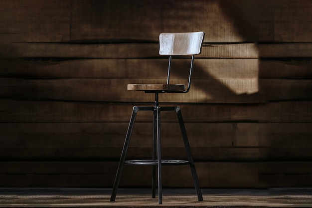 Free photo tall bar stool on a wooden background